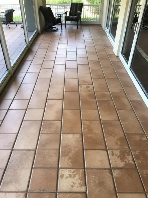 Algae-covered Estero paver lanai before cleaning